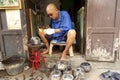 Unidentified man make Baht, the alms bowl used by monks to receive donations of foods