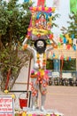 A unidentified man painted his body with silver colour and holding a picture of lord Krishna posed as Vasudeva. Kolkata, West Royalty Free Stock Photo