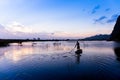 An unidentified man sailing a boat at sunset Royalty Free Stock Photo