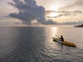 Unidentified man on sea Kayaker Aerial View during sunset. Royalty Free Stock Photo