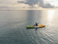 Unidentified man on sea Kayaker Aerial View during sunset. Royalty Free Stock Photo