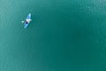 Unidentified man on sea Kayaker Aerial View during sunset.