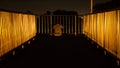 Unidentified man sitting on footbridge at twilight time