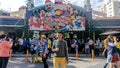 Unidentified man taking photo at the entrance to the Sunway Lagoon water park and theme park