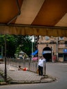 Unidentified man talking on mobile phone on the streets of Mumbai