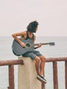 Unidentified man tourist playing the guitar