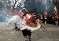 Unidentified man in traditional Kukeri costume is seen at the Festival of the Masquerade Games Kukerlandia in Yambol, Bulgaria Royalty Free Stock Photo