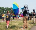 Unidentified Masked Protestors and Woman Holding Umbrella at Hudson Pride
