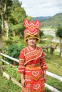 Unidentified Mong tribe young woman with traditional clothes and Royalty Free Stock Photo