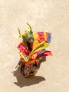 Monk in a bull deity mask with ritual dagger phurpa performs a religious masked and costumed Cham dance of Tibetan Buddhism