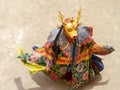 Monk in a deer stag deity mask performs a religious masked and costumed Cham dance of Tantric Tibetan Vajrayana Buddhism
