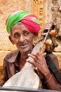 Unidentified musician playing Sitar on Jaisalmer street, India Royalty Free Stock Photo