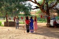 Unidentified Myanmar women are being taken the photo with traditional puppets around.