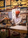 Unidentified old aged Rajasthani man in traditional attire creating carpets by hands Royalty Free Stock Photo