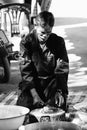 Unidentified old man gutting fish ready to sell in the thai traditional market chiangmai Province, Thailand