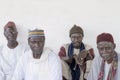 Unidentified old Muslim men waiting for the opening of the mosque, celebration clothing, serious expression