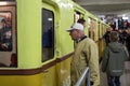Unidentified older man watching an exhibition of old subway cars