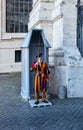 unidentified Papal Swiss guard standing at the Vatican Museums door in the Vatican