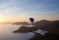 Paraglider flying at sunset over Blue lagoon in Oludeniz, Turkey