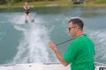 Unidentified participant shows skills during open waterski competition