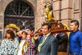 Unidentified participants in traditional clothes celebrate religious festivity in front of the Cathedral of Santo Domingo in Cusco