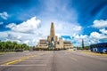 Unidentified people and cars on parkinkg in front of basilica La Altagracia Church in Higuey, Dominican Republic