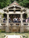 unidentified people collecting water from the Otowa-no-taki waterfall at Kiyomizu temple