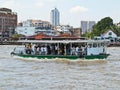 Unidentified people cross Chao Phraya river by ferry boat in Bangkok, Thailand. Royalty Free Stock Photo