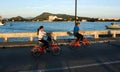 Unidentified people cycling bicycle at Sriracha port