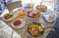 Unidentified people eating traditional delicious mediterranean dish outdoor restaurant in Cyprus