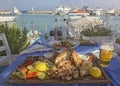 Unidentified people eating traditional delicious mediterranean dish outdoor restaurant in Cyprus