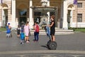 Unidentified people and girl on segway near Slovak National Theatre, Bratislava, Slovakia Royalty Free Stock Photo