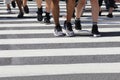 Unidentified people legs crossing street Royalty Free Stock Photo