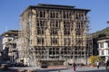 Unidentified people look at a building under construction in Paro, Bhutan