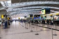 Unidentified people at one of the main Terminal Lounge of Heathrow Airport. Check-in area. London, United Kingdom Royalty Free Stock Photo