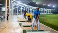 Unidentified people playing golf at Puncak Alam Golf Driving Range during the night