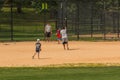 Unidentified people plays amateur baseball in Central Park.