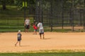 Unidentified people plays amateur baseball in Central Park.