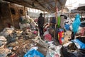 Unidentified people from poorer areas working in sorting of plastic on the dump. Royalty Free Stock Photo