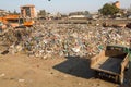 Unidentified people from poorer areas working in sorting of plastic on the dump. Royalty Free Stock Photo