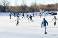 Unidentified people skating on the outdoors ice rink