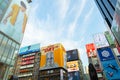 Unidentified people tourist walking around of Dotonbori district surrounding of advertisements sign at Namba area