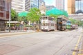 Unidentified people are using city trams in Hong Kong