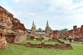 Unidentified people visit damaged Buddha statues Royalty Free Stock Photo