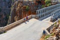 Unidentified people visit famous truss bridge over Aradena Gorge on Crete Island, Greece Royalty Free Stock Photo