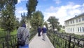 Unidentified people walk toward Cathedral Square in Holy Trinity Seraphim-Diveevo monastery in village of Diveevo, Russia