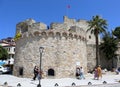 Unidentified people walking by the Historic Cesme Castle in Cesme, Turkey.