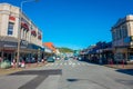 Unidentified people walking in the street in main South Road, Greymouth, New Zealand