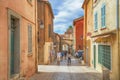 Unidentified poople walking in street, Architecture of Saint Tropez city in French Riviera, France