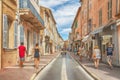 Unidentified poople walking in street, Architecture of Saint Tropez city in French Riviera, France